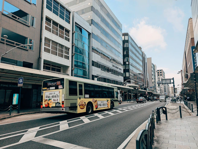 A bus is driving down a city street