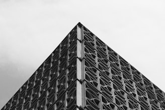 A black and white photo of a tall building