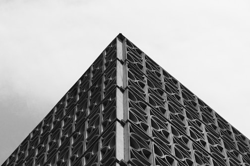 A black and white photo of a tall building