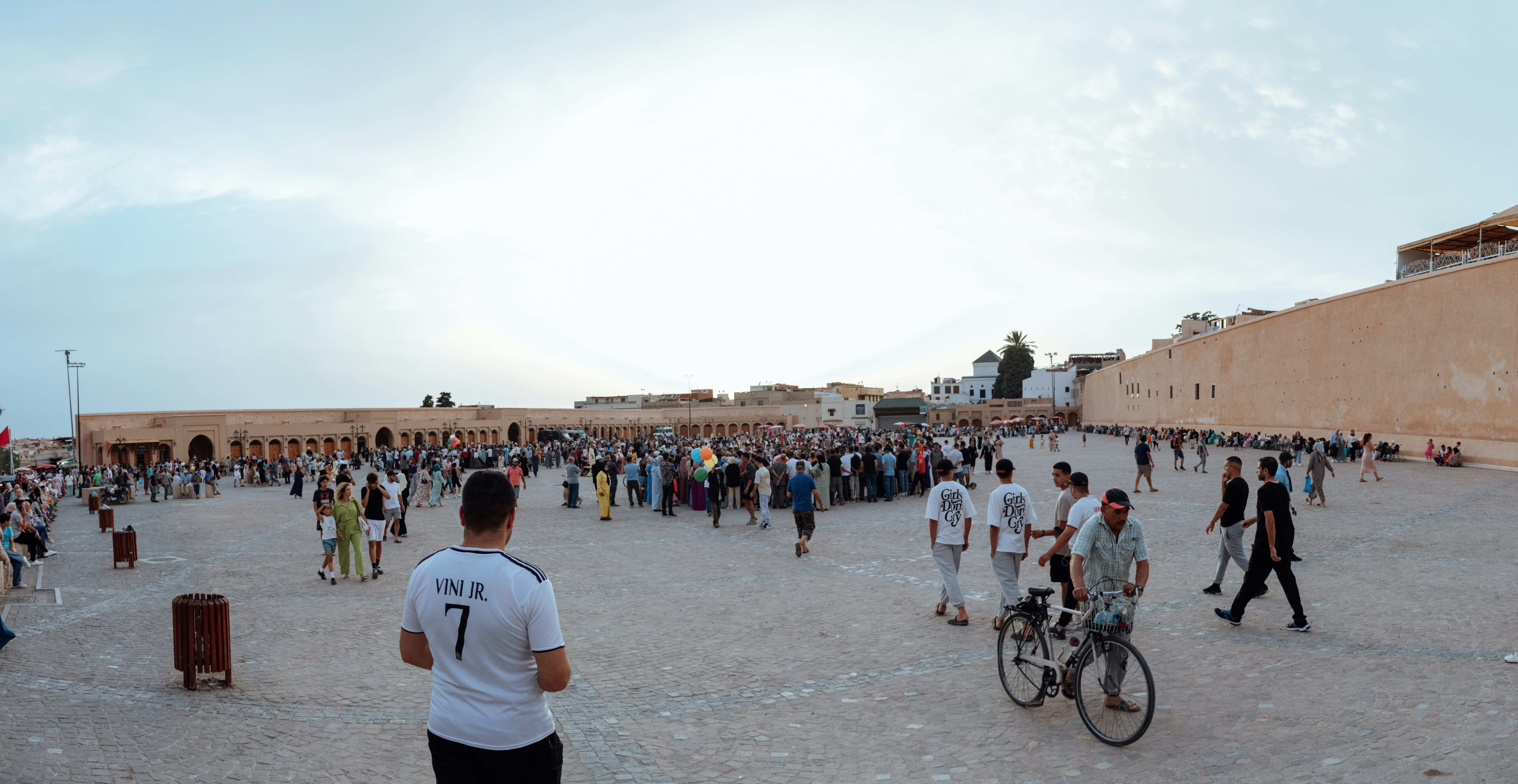 A group of people standing around a building