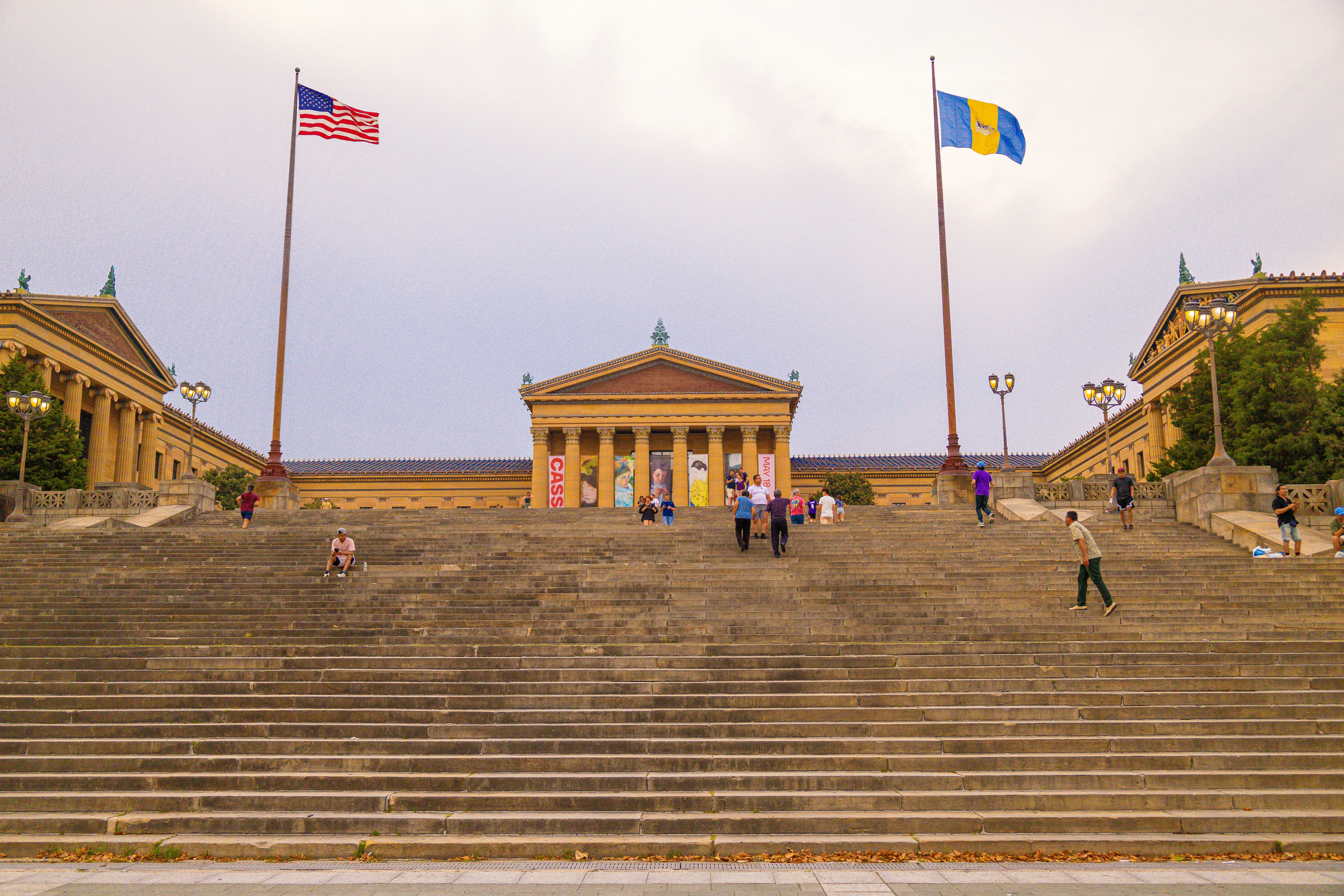 A group of people walking up a set of stairs