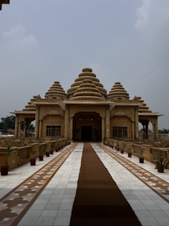 A large building with a long walkway leading to it