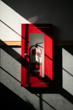 A fire extinguisher hanging on a wall representing a Decision Readiness Simulations