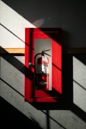 A fire extinguisher hanging on a wall