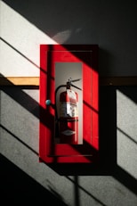 A fire extinguisher hanging on a wall