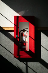 A fire extinguisher hanging on a wall
