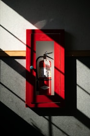 A fire extinguisher hanging on a wall