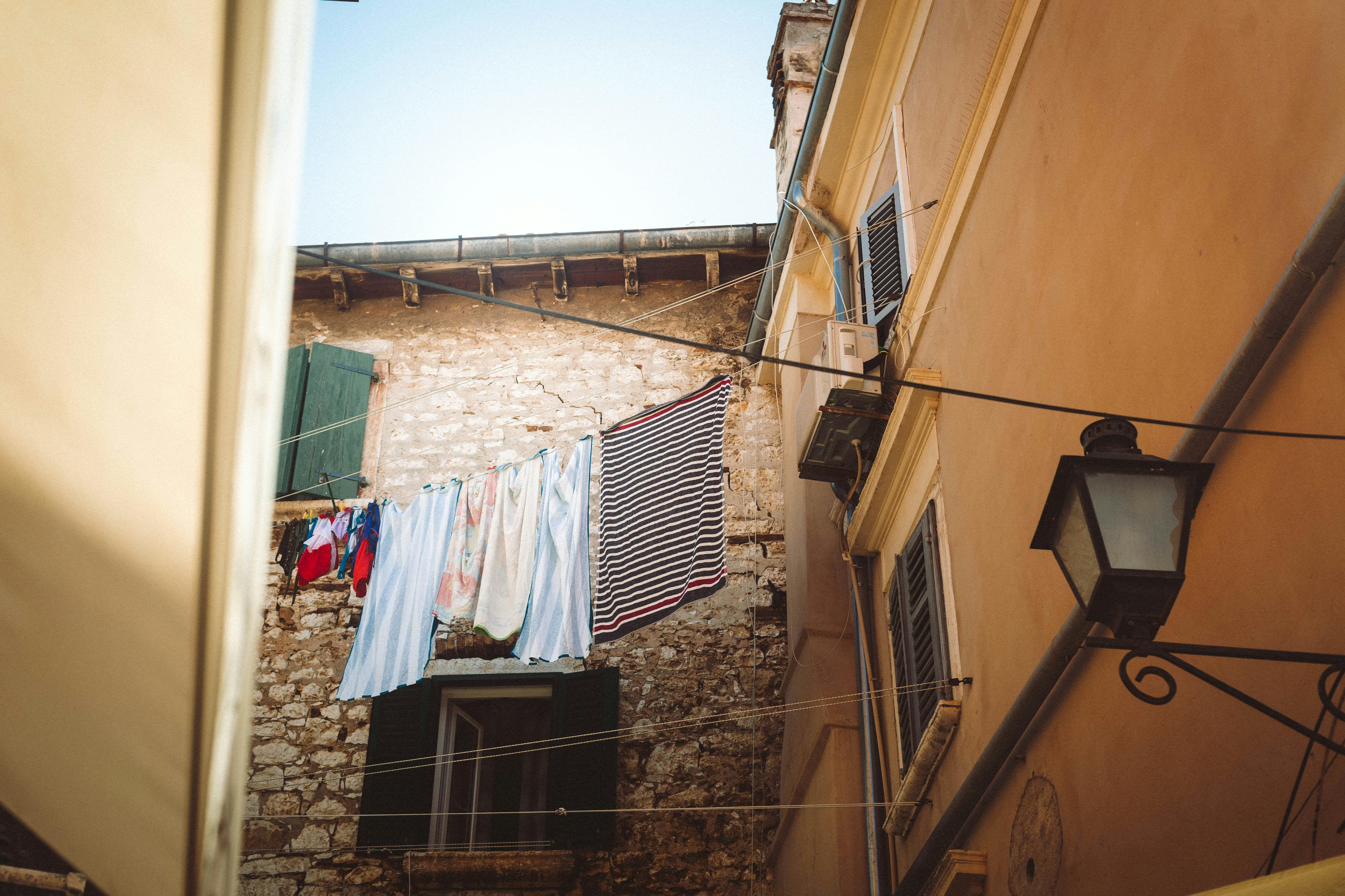A narrow alley with clothes hanging out to dry