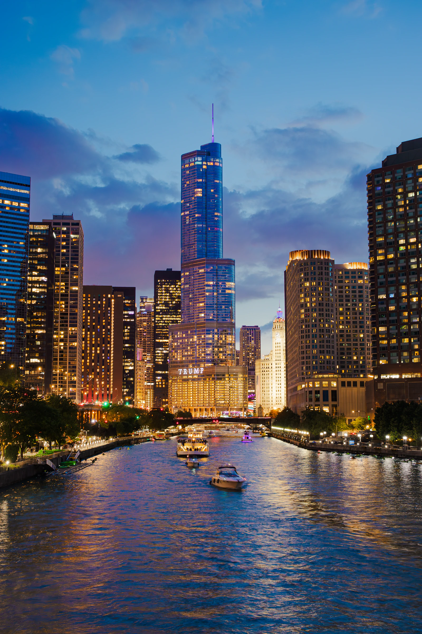 Chicago architecture illuminated along the river at dusk