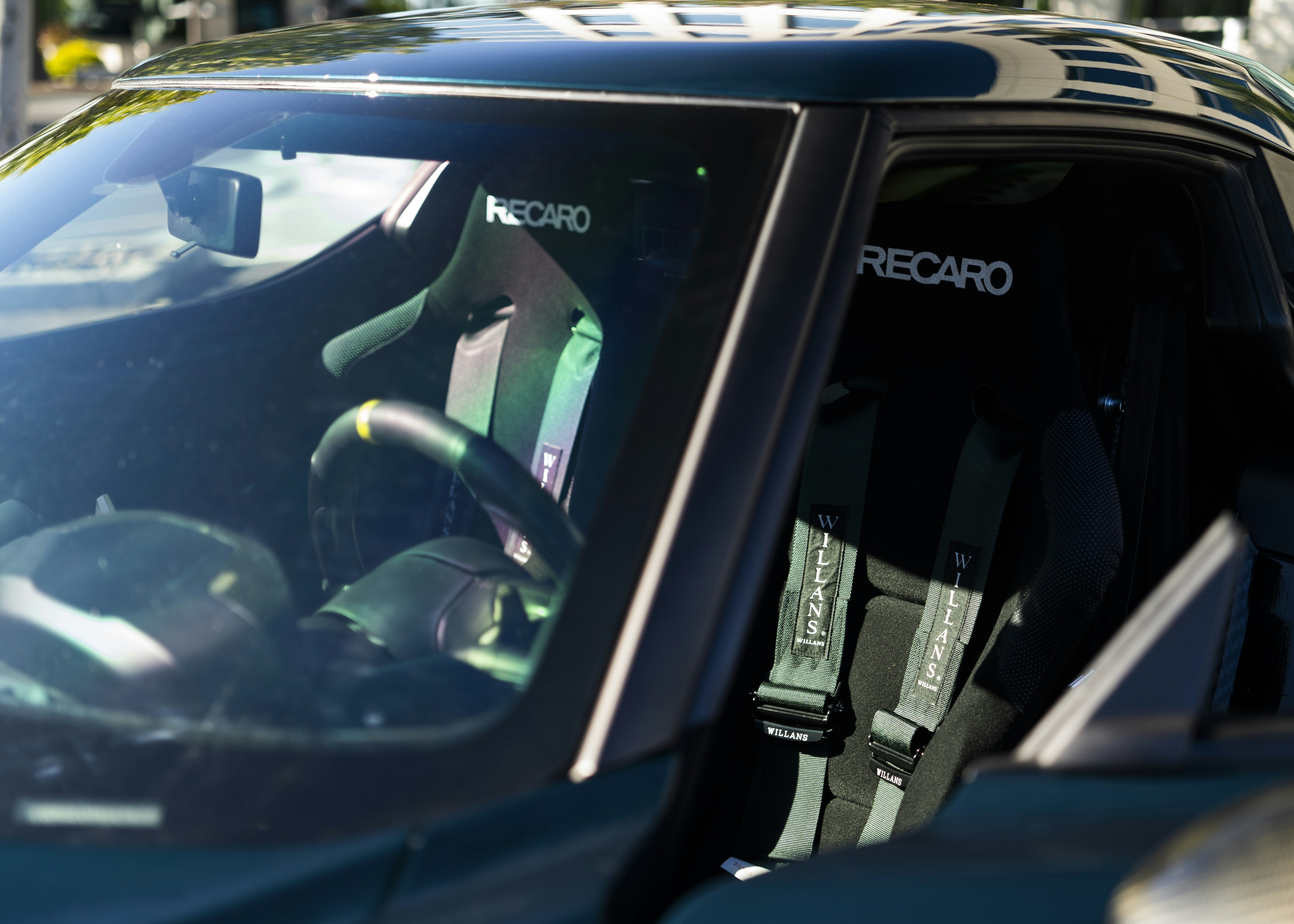 Volvo XC60 hybrid SUV driving through a modern city street