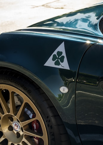 A close up of a car with a shamrock sticker on it