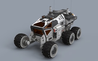 A white and black vehicle on a gray background