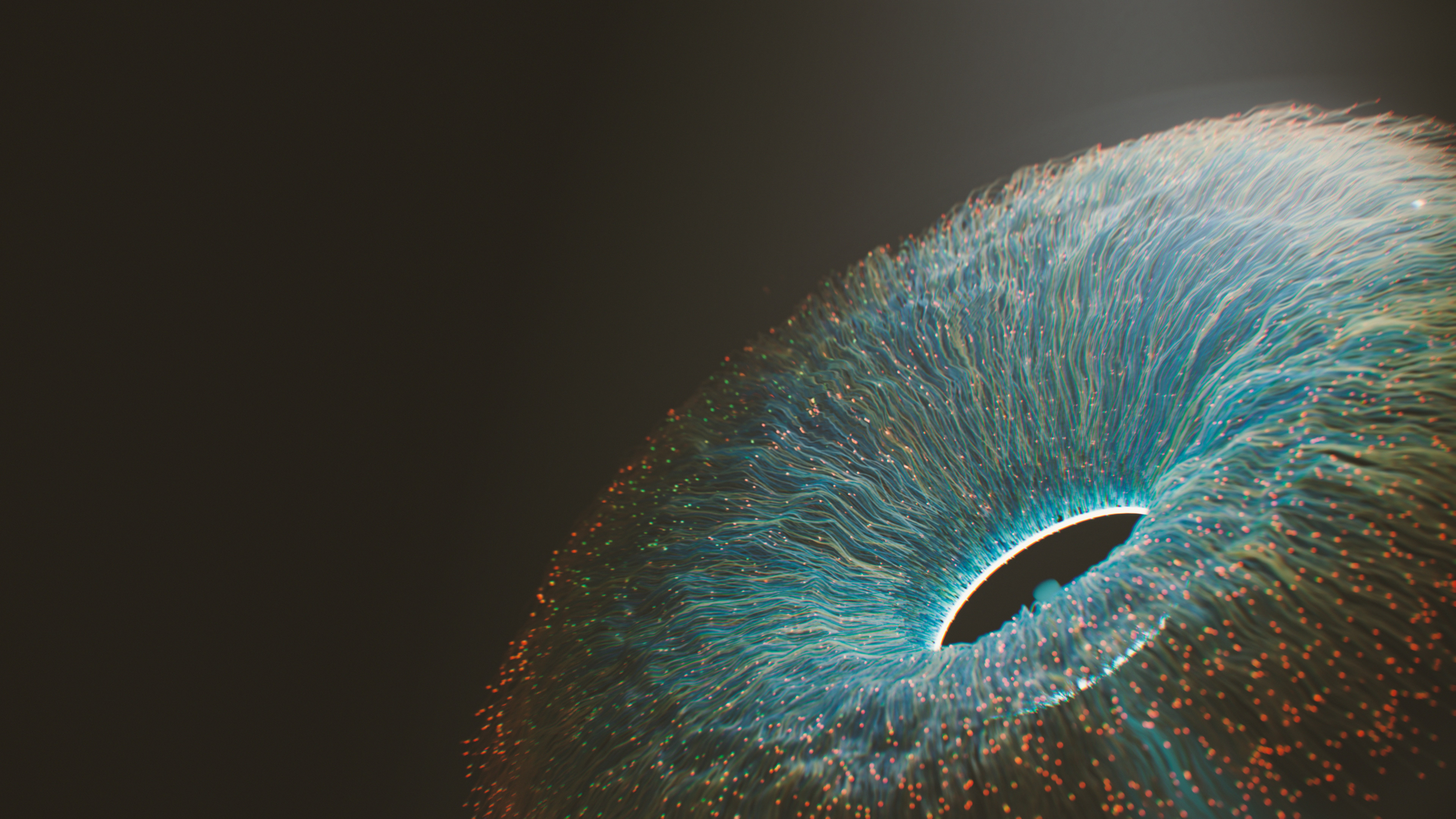 A close up of an eyeball with a black background