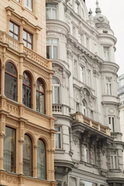 A row of buildings with a clock on the top of one of them