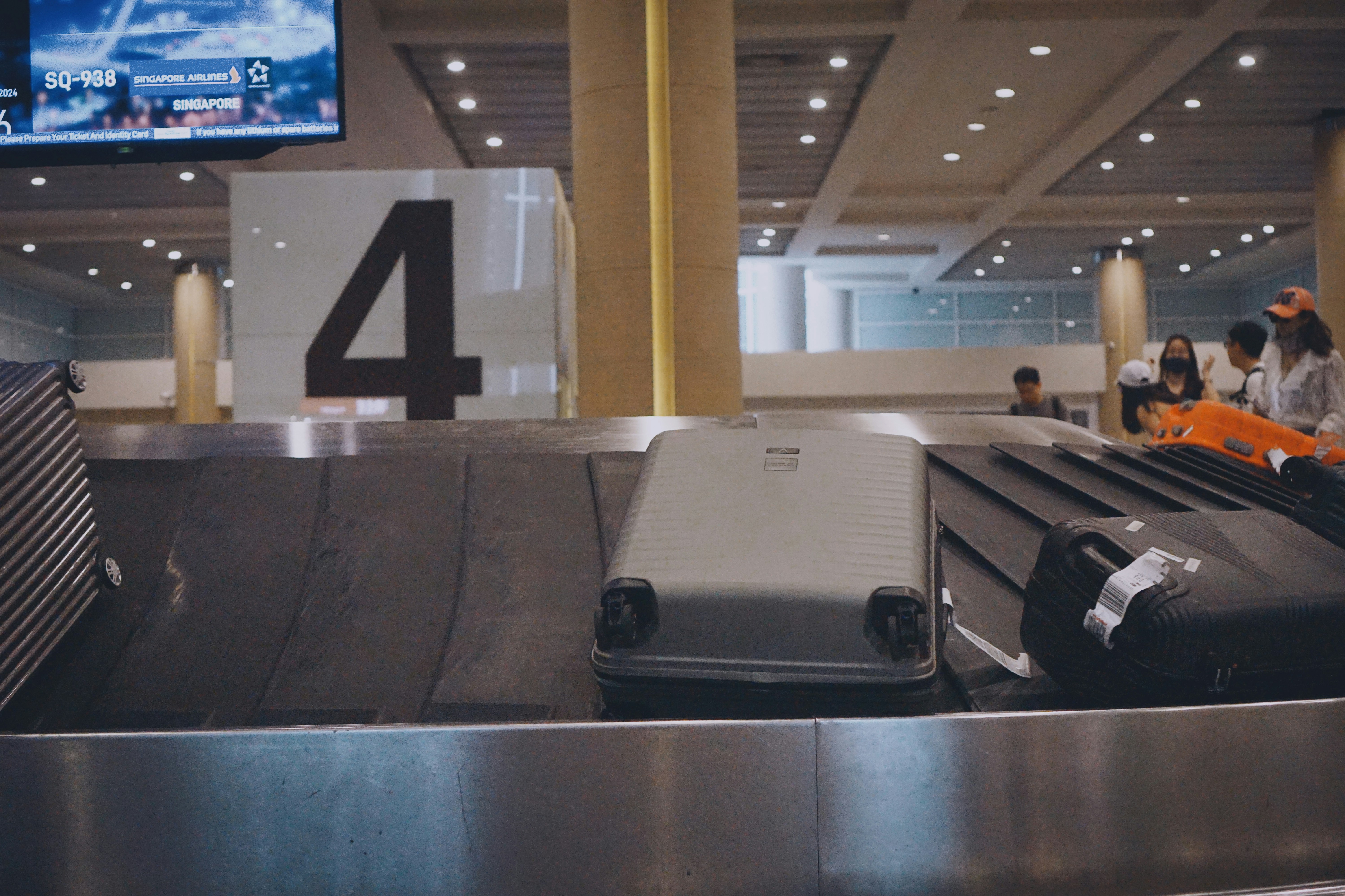 A couple of suitcases sitting on top of a conveyor belt