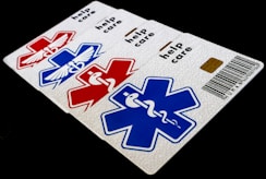 A close up of a card with a medical symbol on it