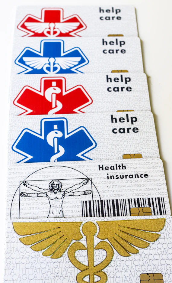 A pair of medical id cards with a cadus symbol