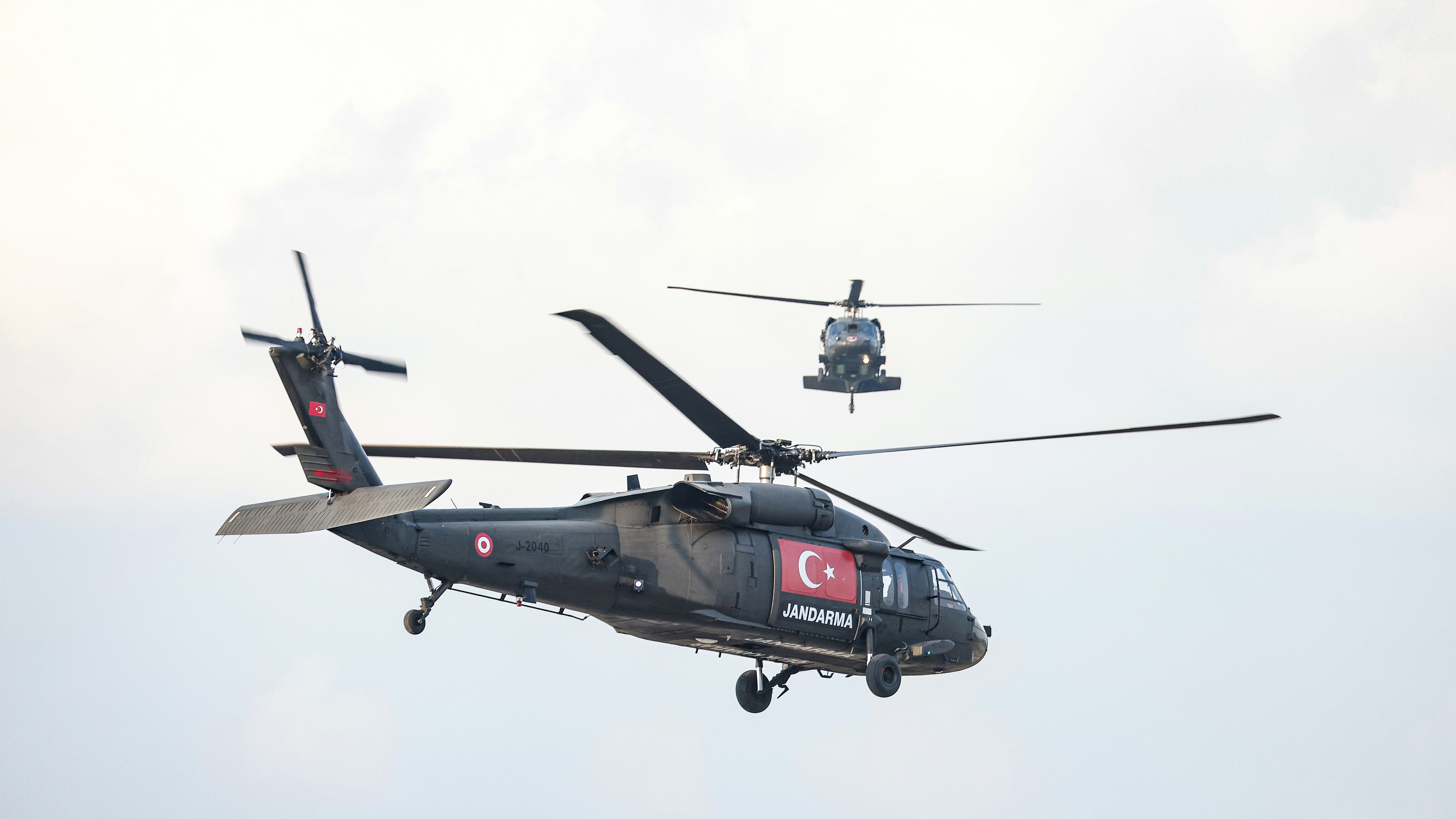 A helicopter that is flying in the air