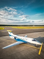 A small airplane is parked on the runway