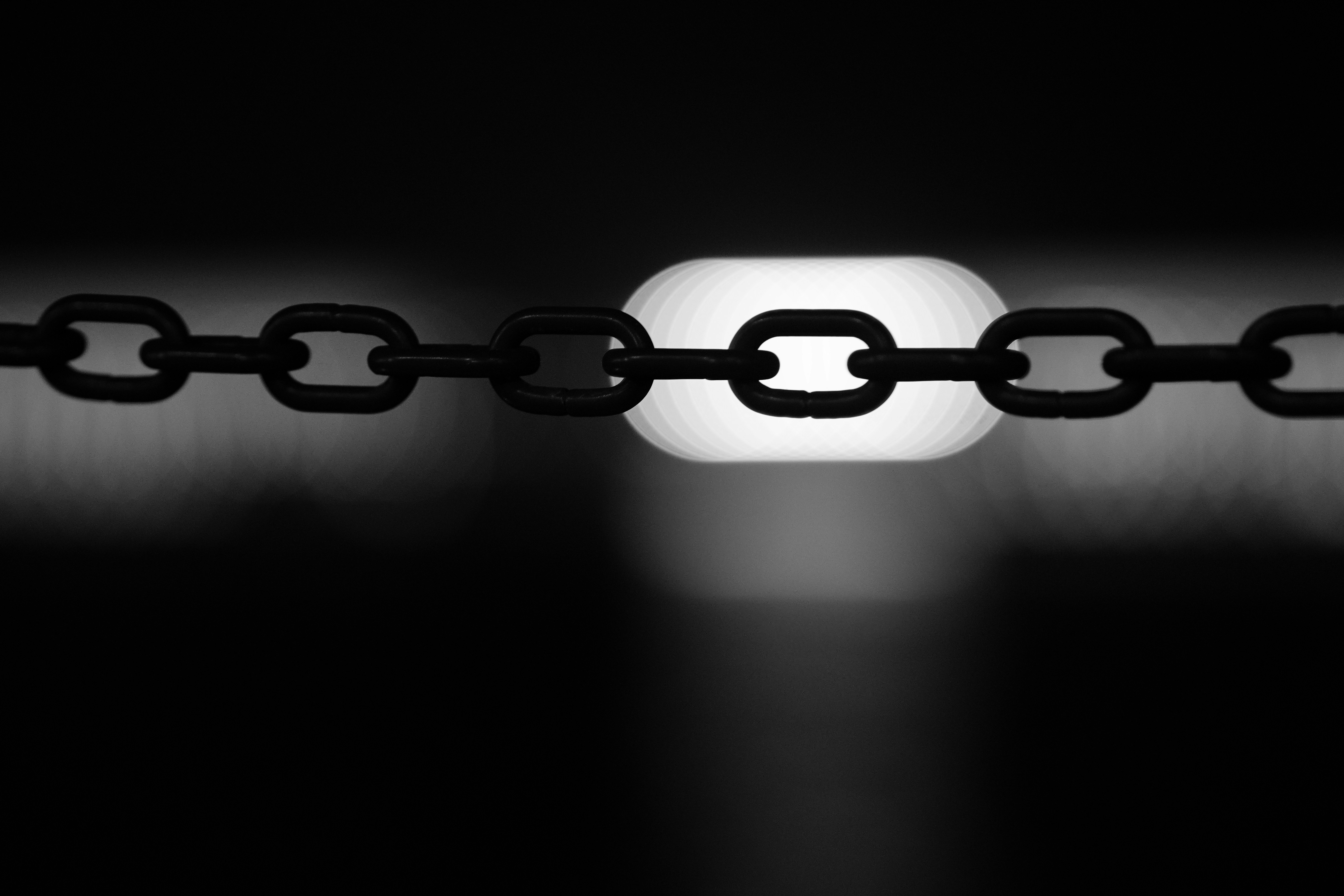 A black and white photo of a chain