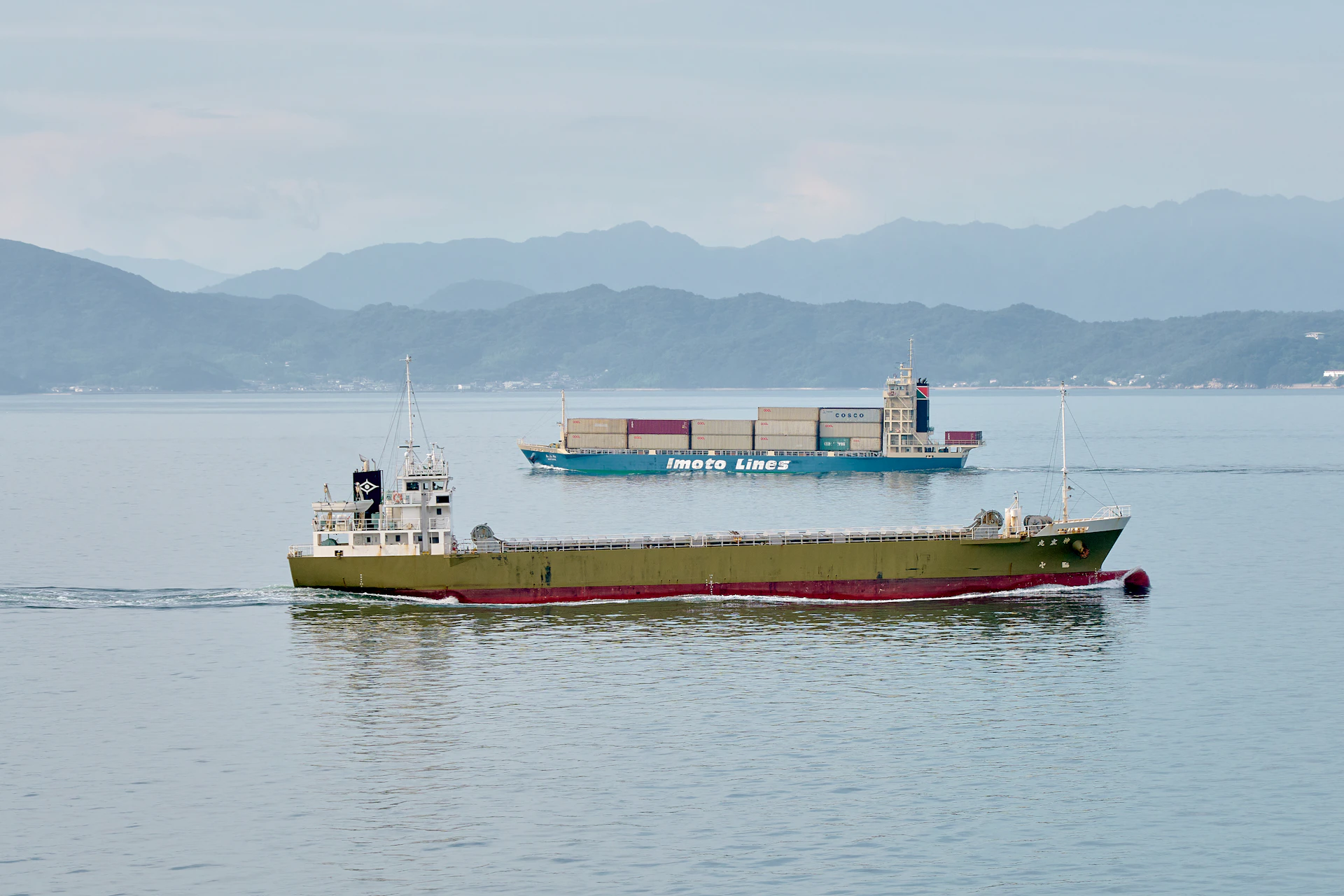 A large boat floating on top of a large body of water