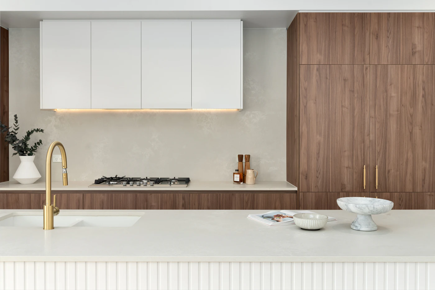 Minimal kitchen in white and walnut