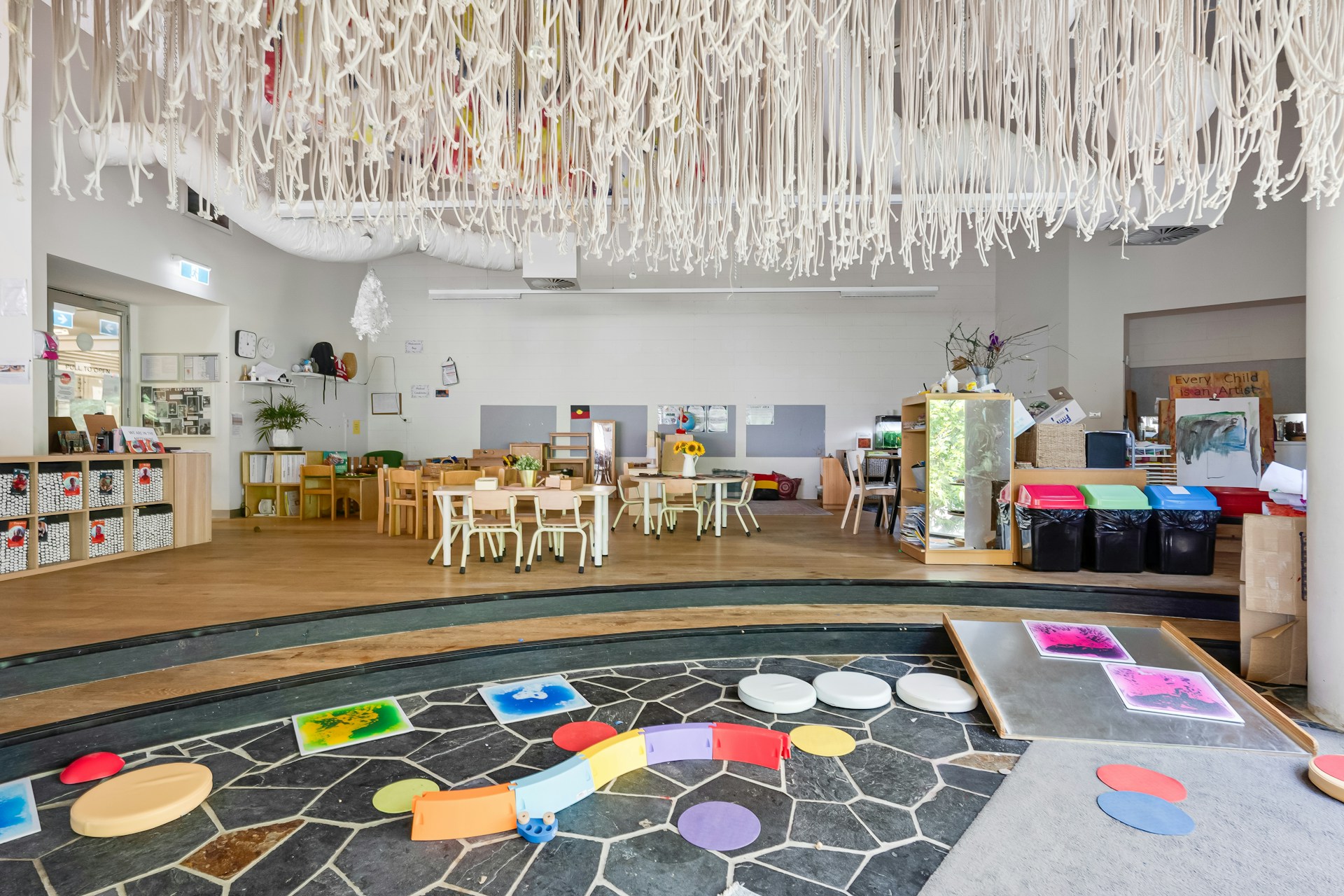 A room filled with lots of tables and chairs