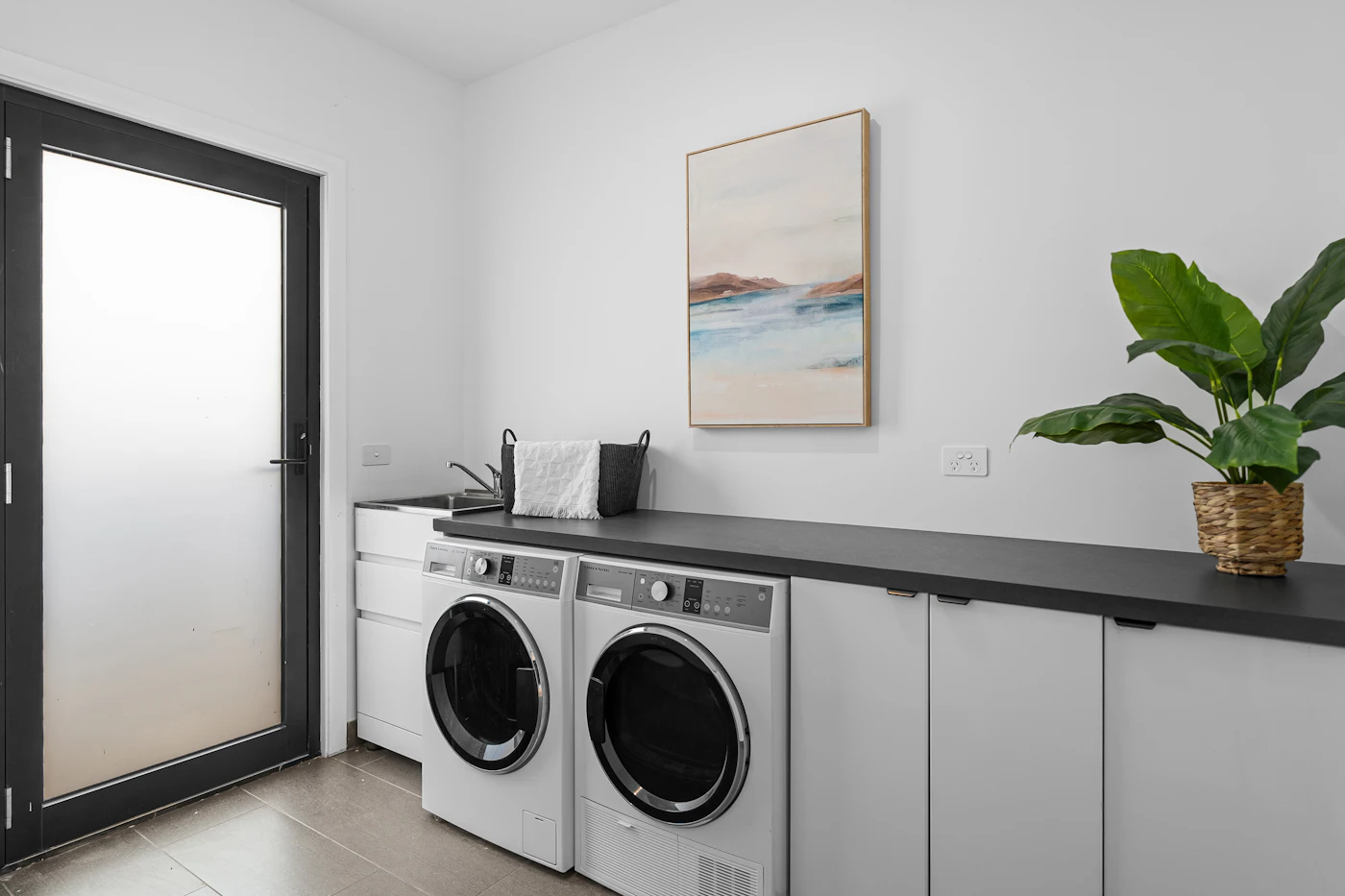 Modern laundry room with washer and dryer