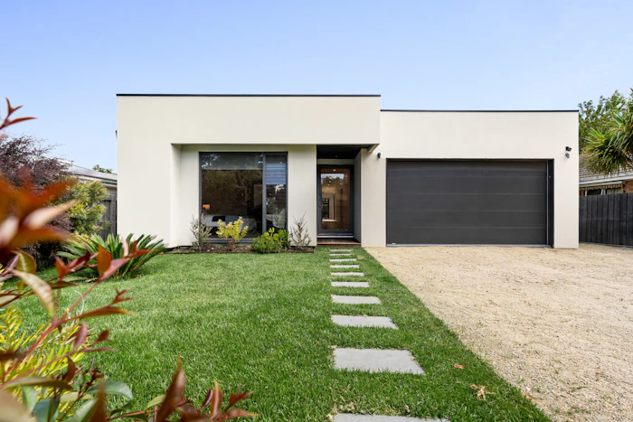 Single storey modern Australian home with a landscaped front garden.