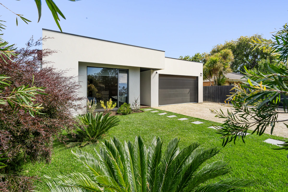 Bright contemporary home with a clean facade and landscaped front yard