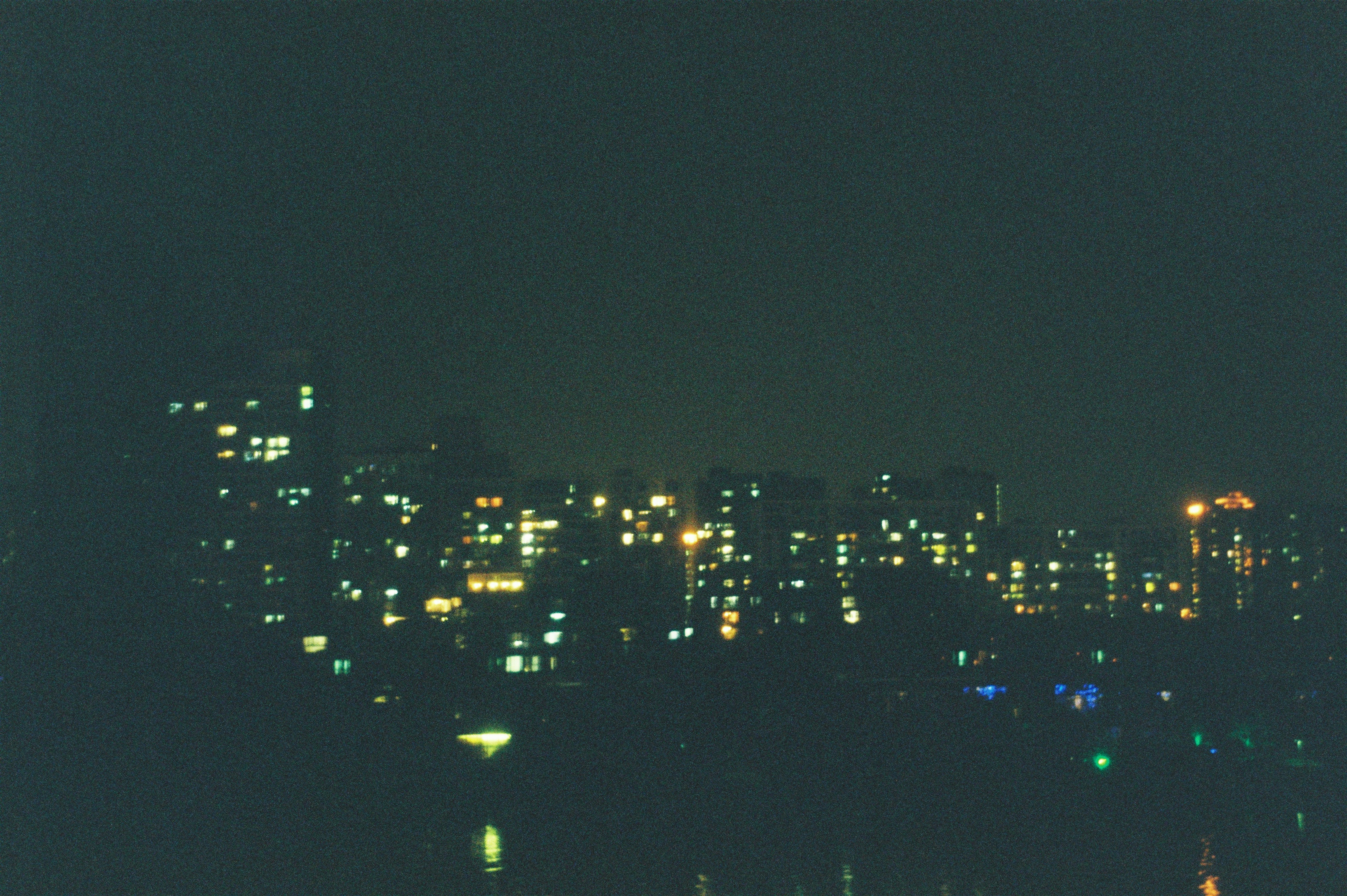 A view of a city at night from across the water