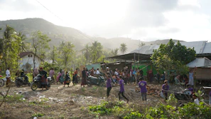 A group of people standing around a village