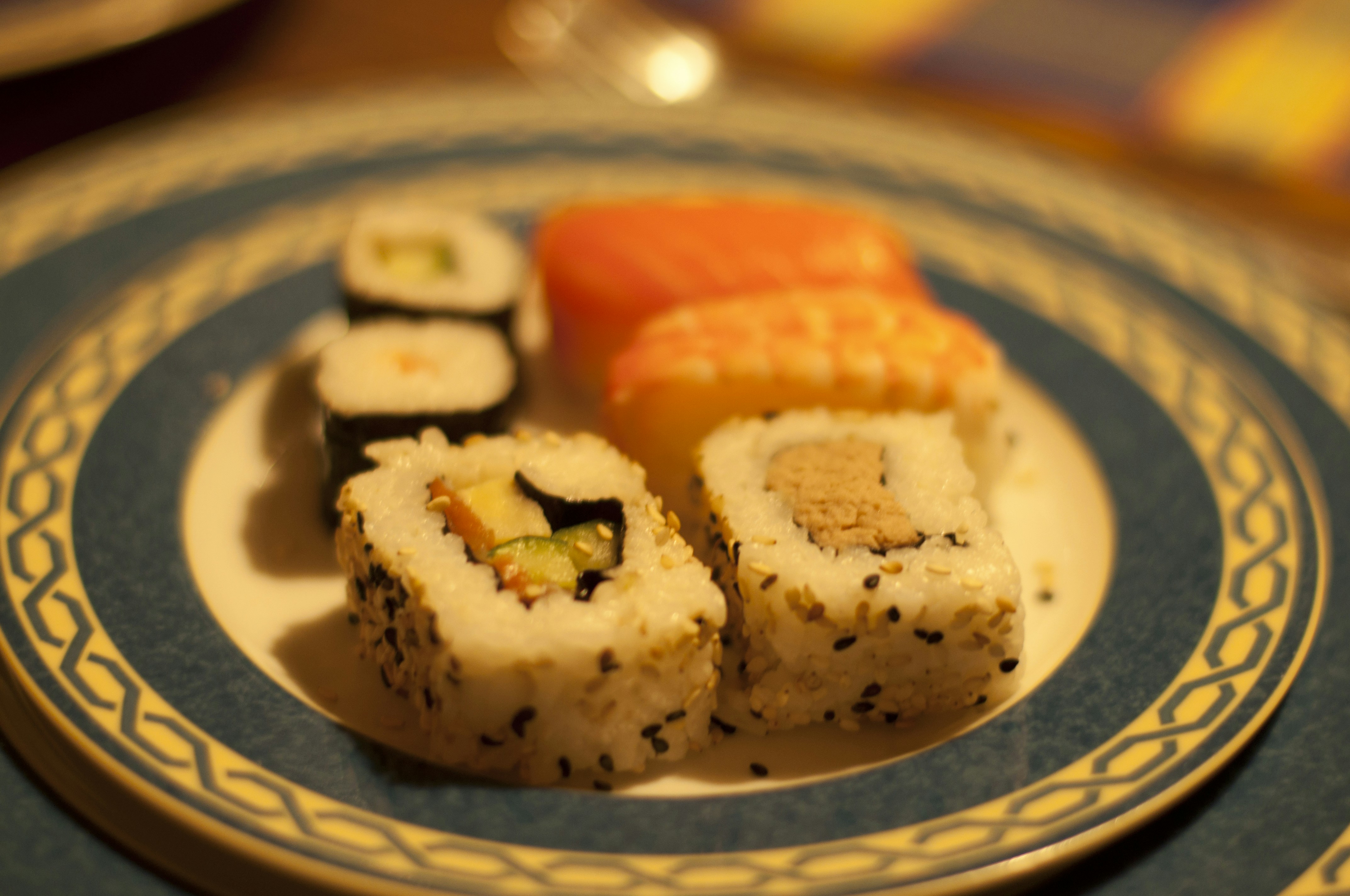 A plate with sushi on it on a table