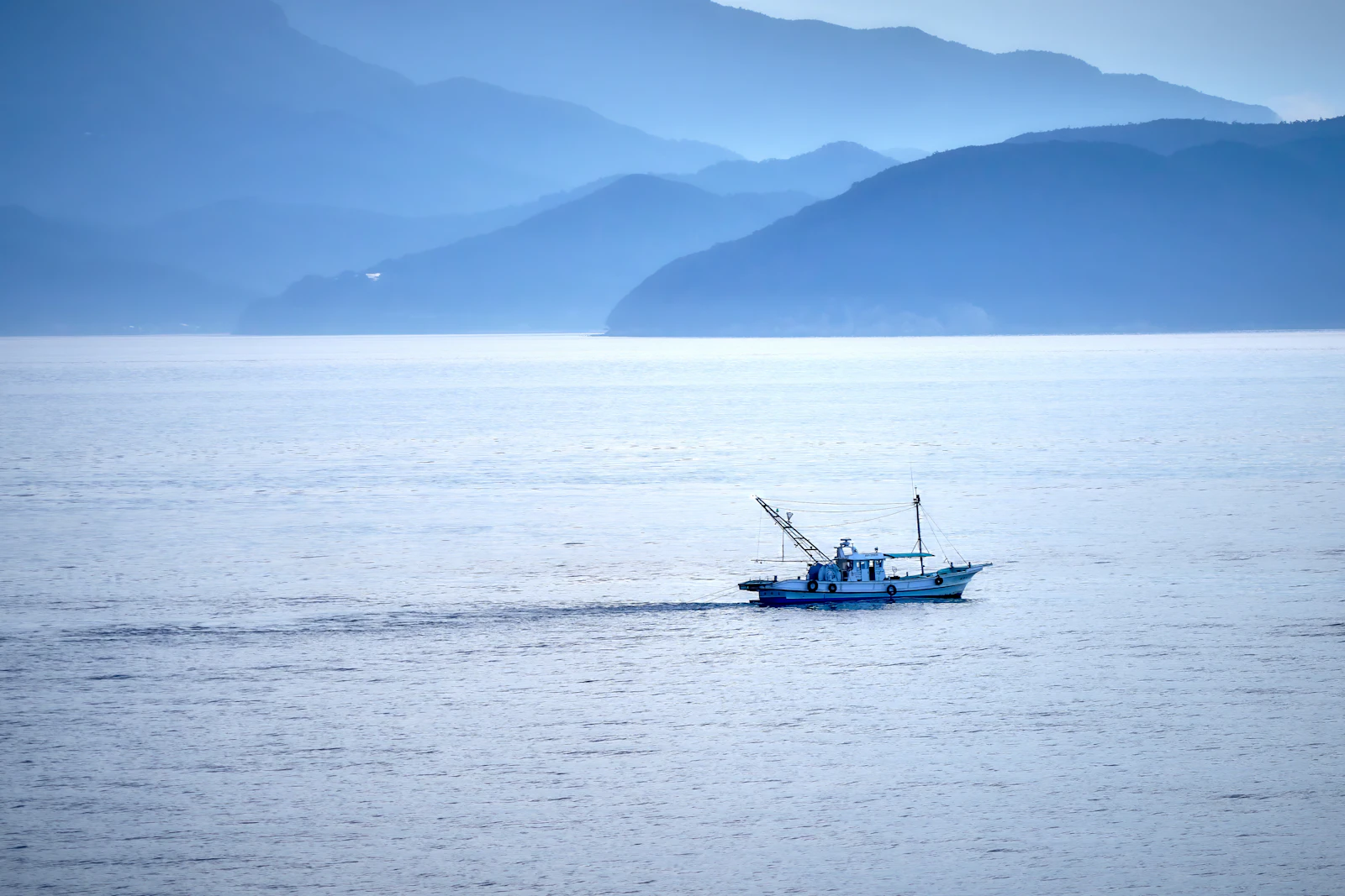 Illustrative photograph of a fishing boat on the water in Japan