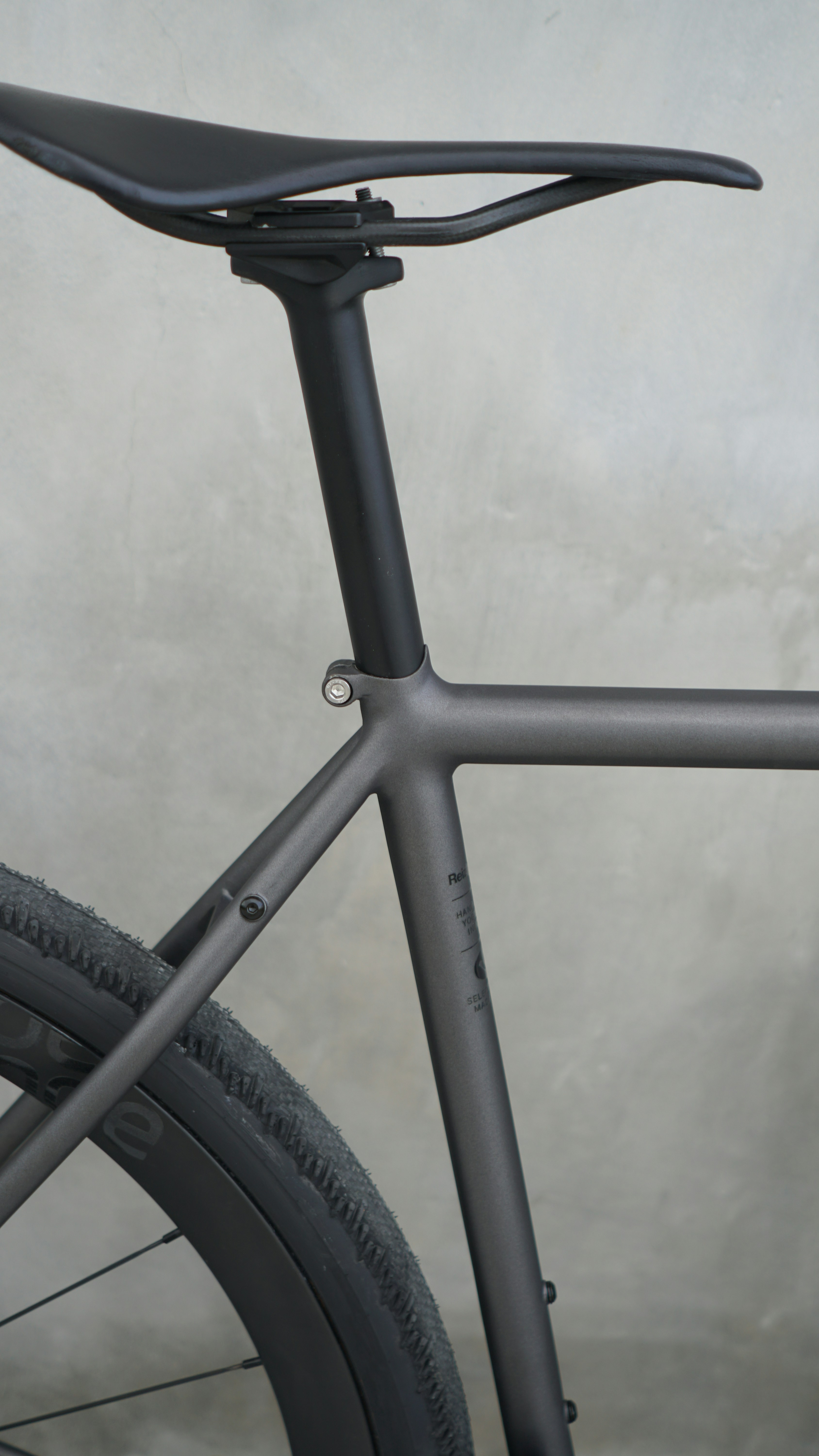 A close up of a bike with a grey background