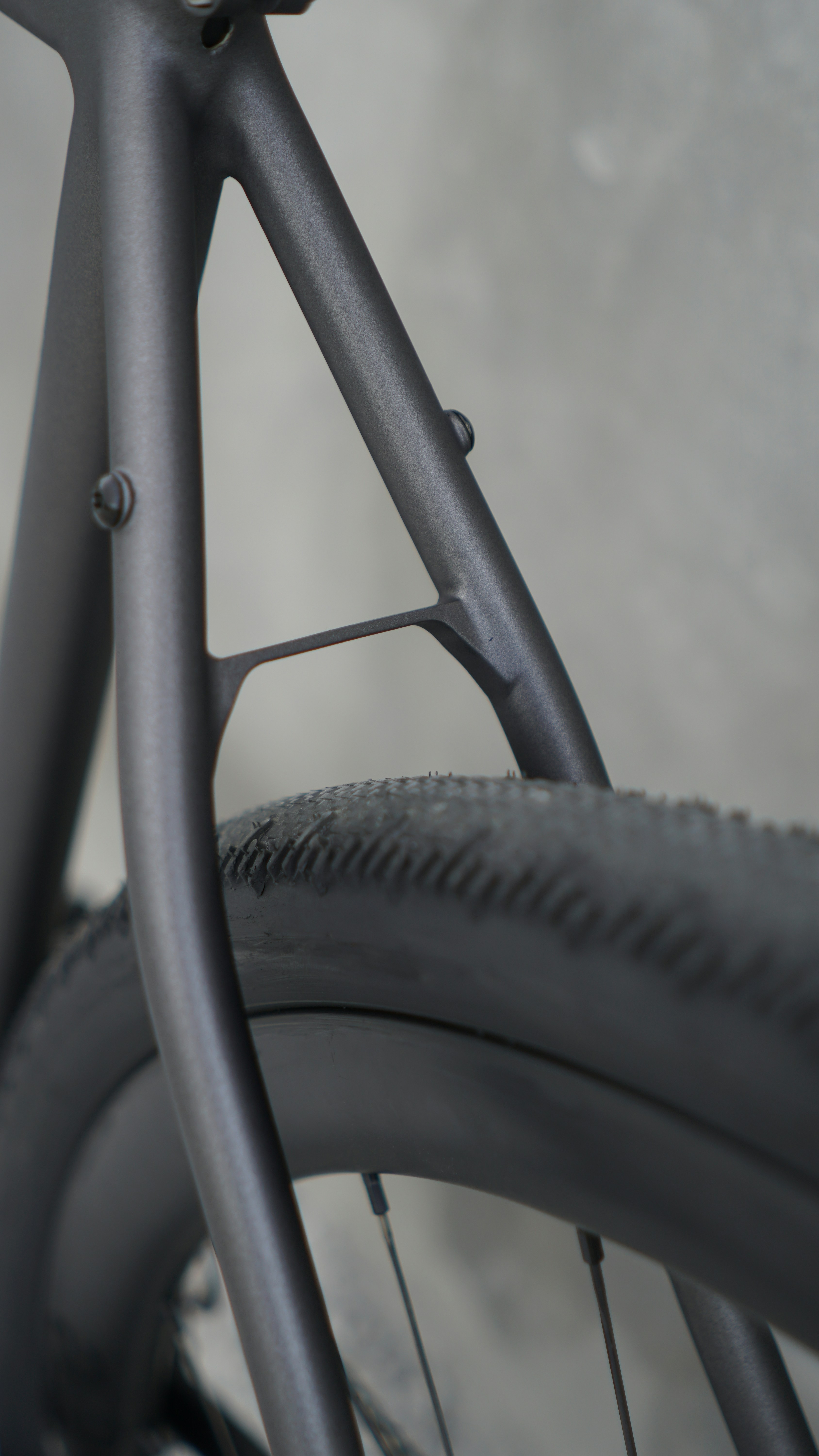 A close up of a bike tire and spokes