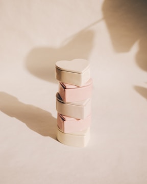 A stack of three boxes sitting on top of a table