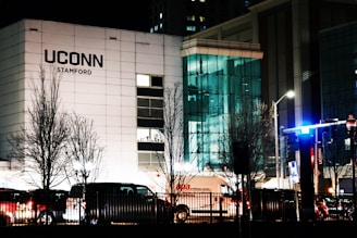 A large white building sitting next to a traffic light