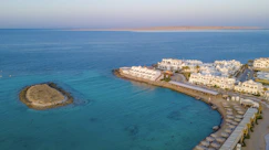 A bird's eye view of a resort on the water