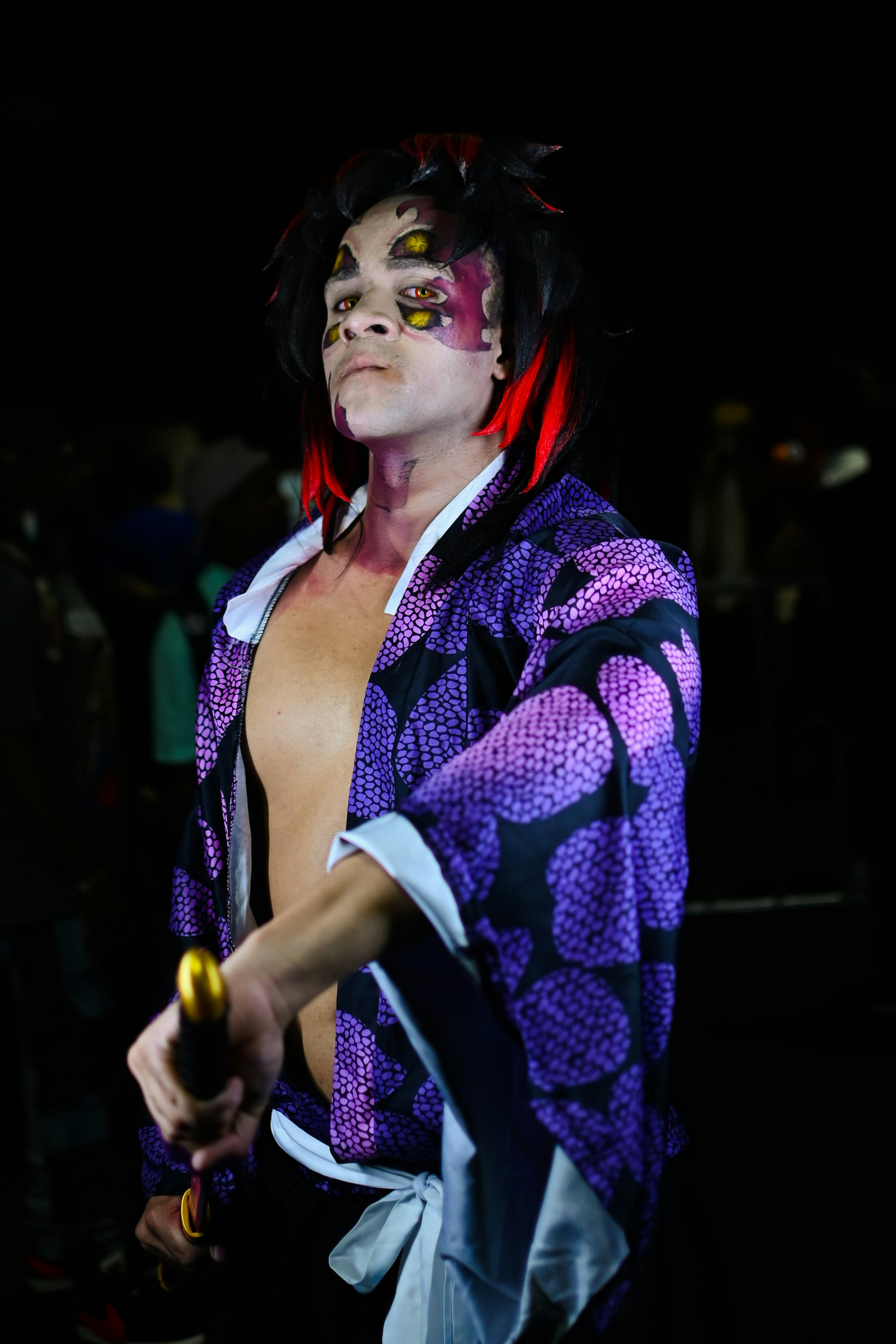 A man dressed in a costume holding a bottle