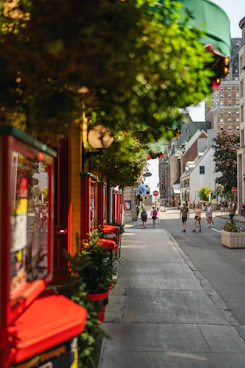 A street lined with shops and people walking down it