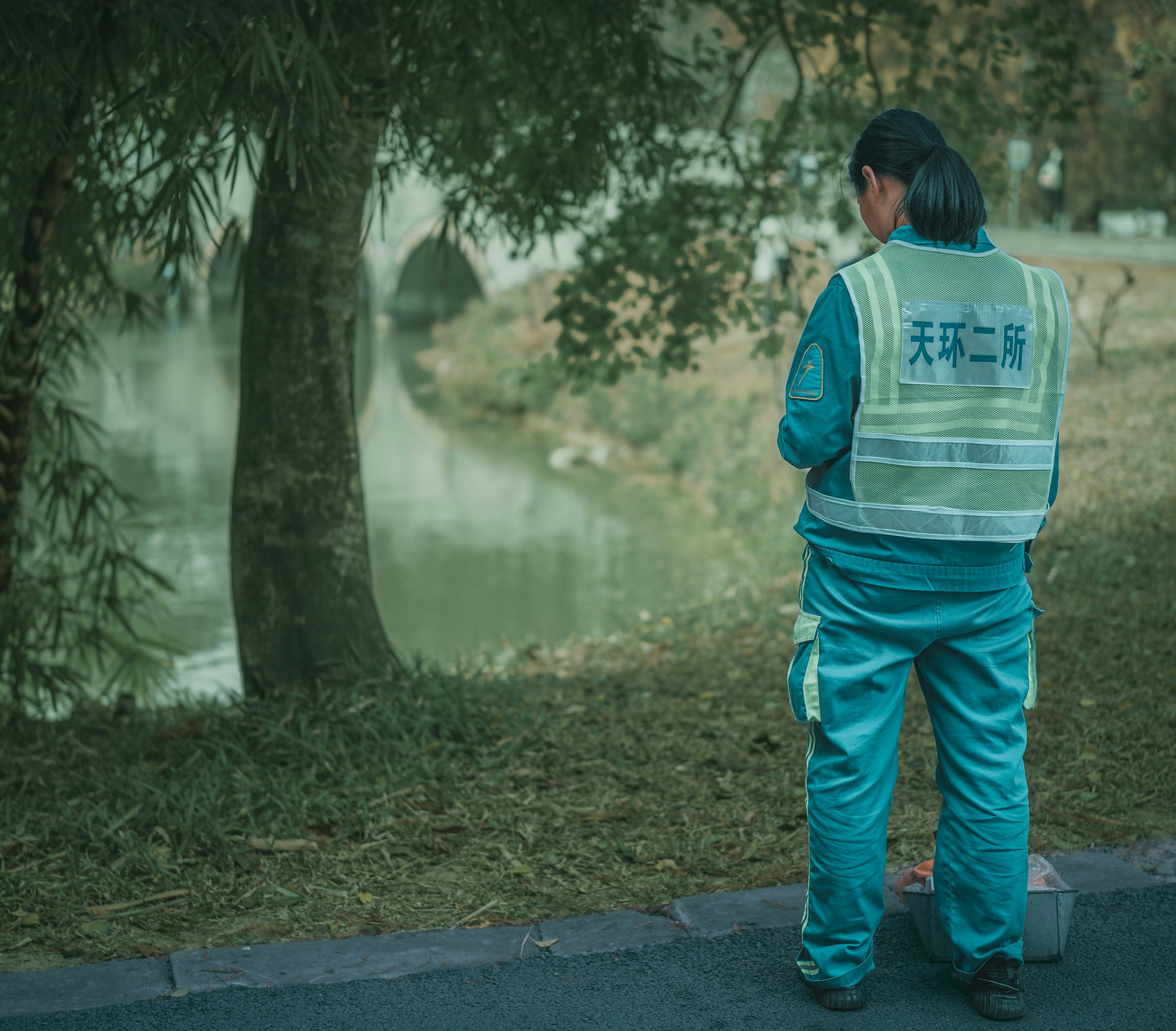 A man standing on the side of a road