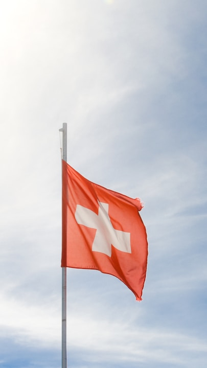 A red and white flag flying in the sky