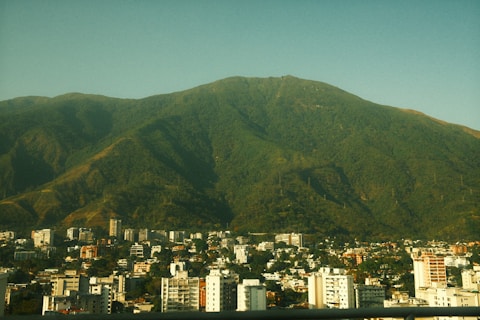 A view of a city with mountains in the background