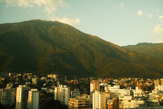 A view of a city with mountains in the background