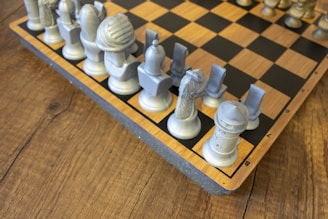 A wooden chess board with chess pieces on it
