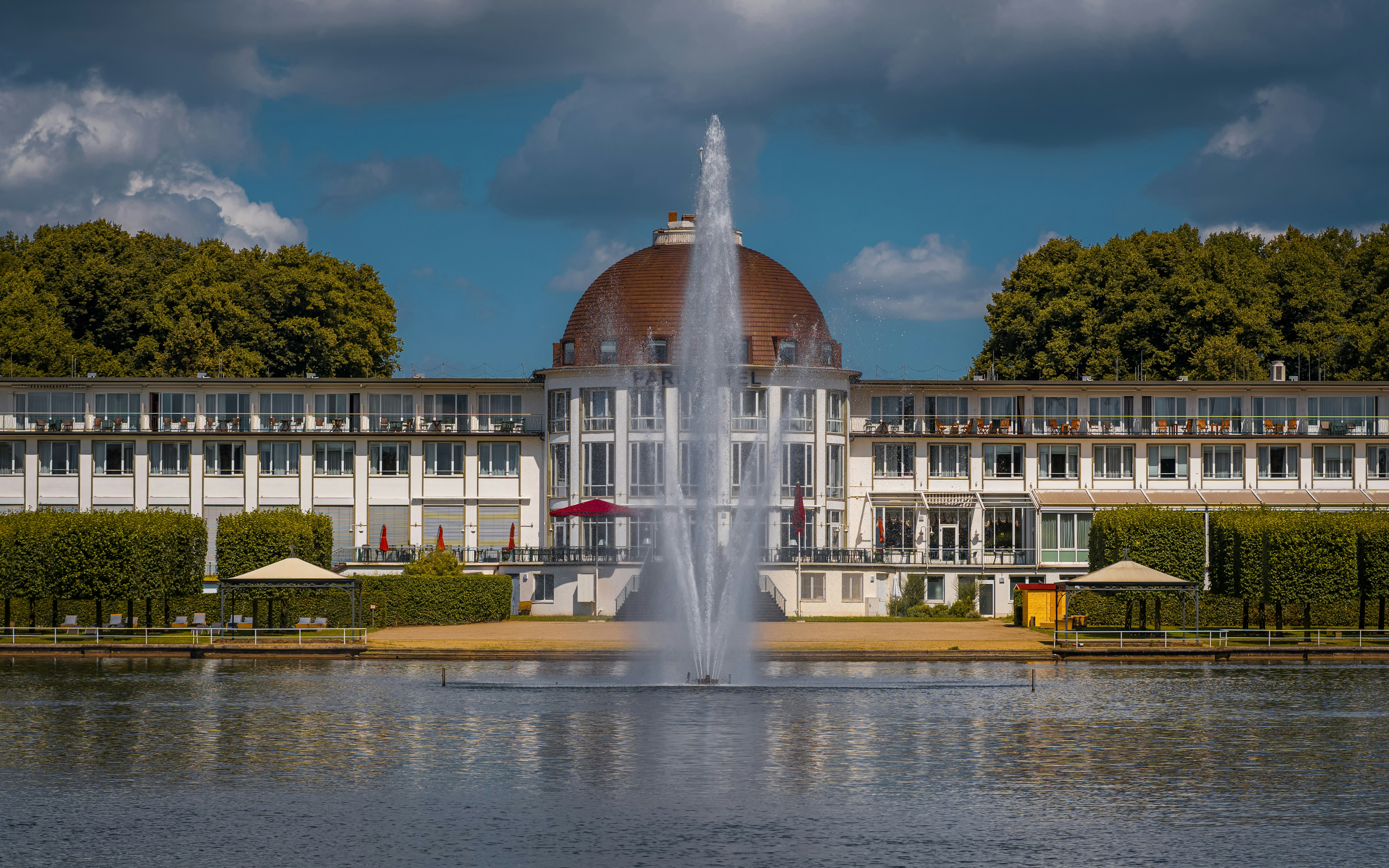 A large building with a fountain in front of it