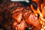 A large piece of meat sitting on top of a grill