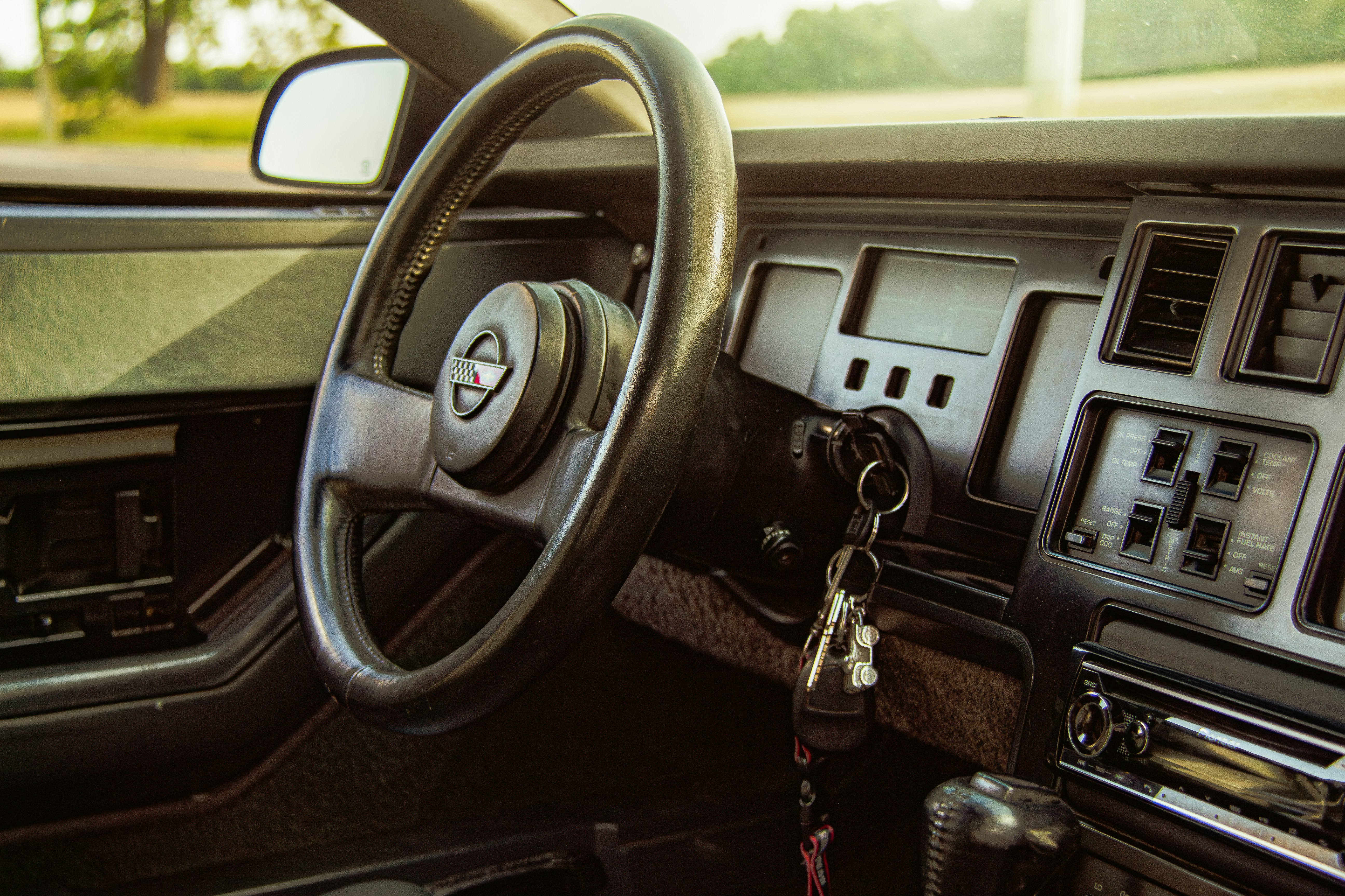 Electric sedan interior with digital dashboard showing remaining range