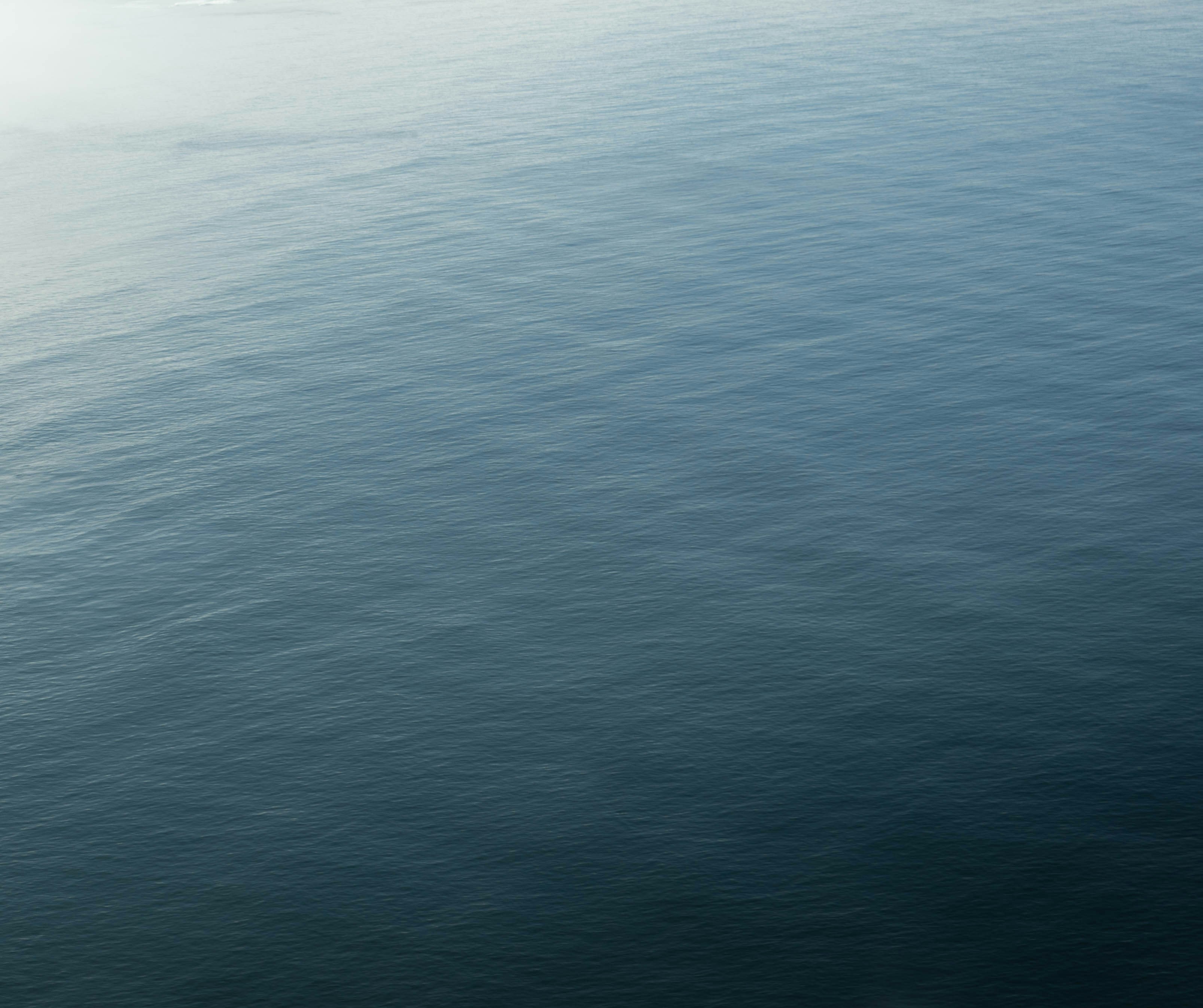 A large body of water with a boat in it
